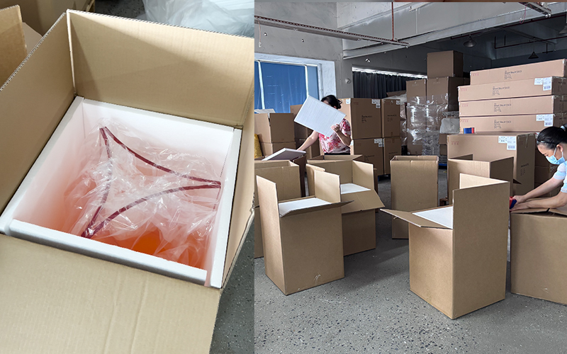 Gradient orange acrylic panel packed with foam inside corrugated export carton, factory packaging station