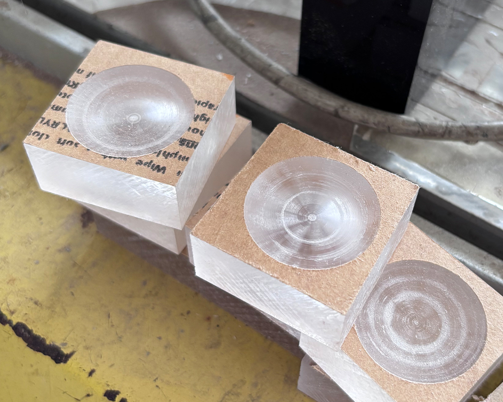Transparent acrylic dome mold blanks fixed on kraft foam packaging blocks for furniture production