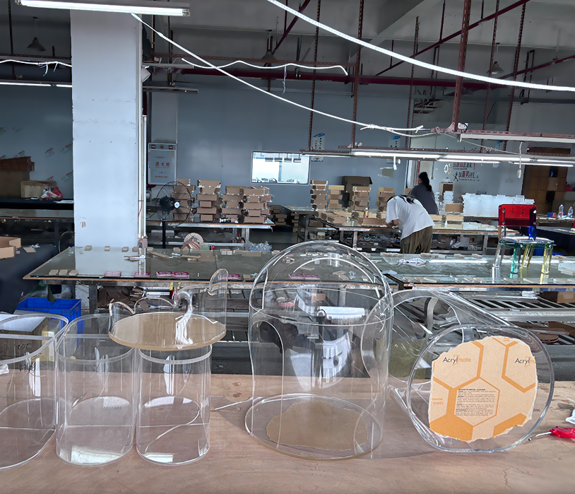 Acrylic pet factory workshop, semi-finished transparent dome acrylic cat house blanks laid out on assembly worktables