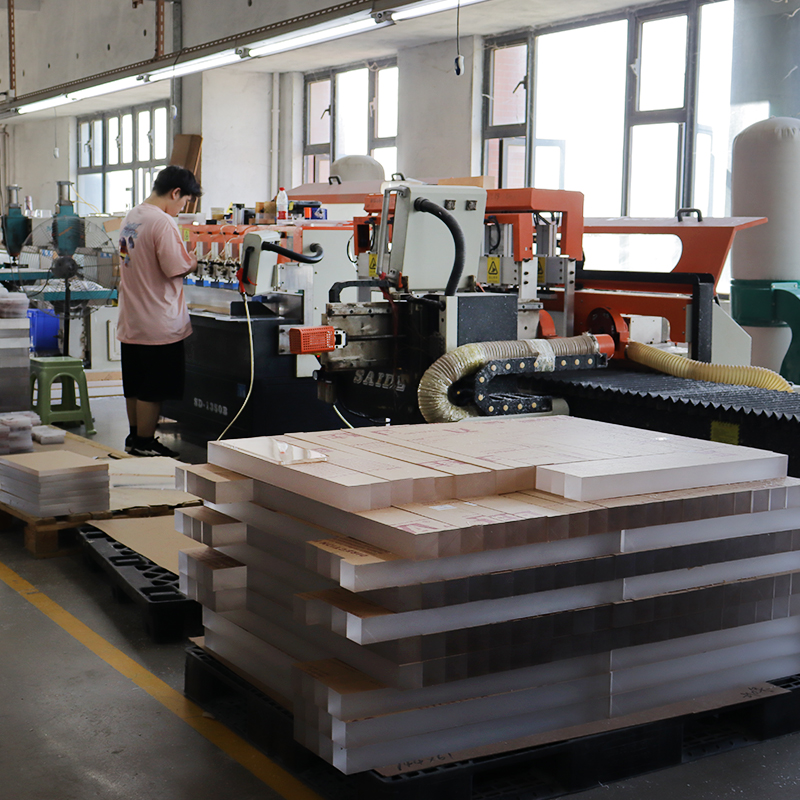 Industrial factory workshop with acrylic board cutting and milling machinery