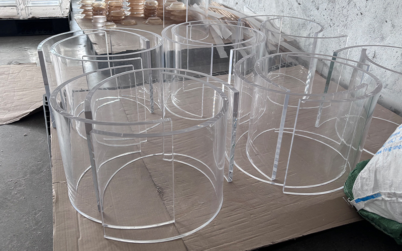 Stack of clear hollow cylindrical acrylic tube blanks for custom display craft