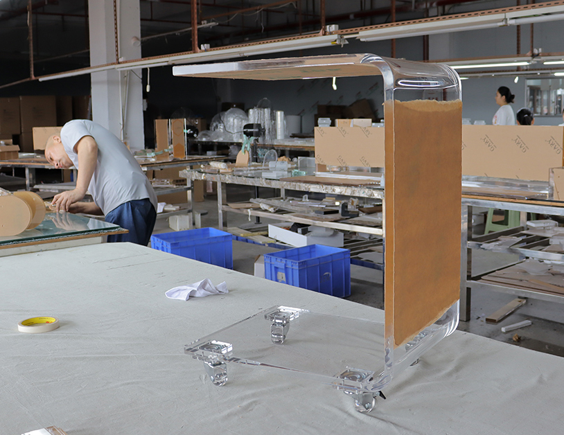 Heavy-gauge-clear-acrylic-C-table-with-wheels-assembly,-100%-virgin-MMA-lucite-rolling-side-table-fabrication.