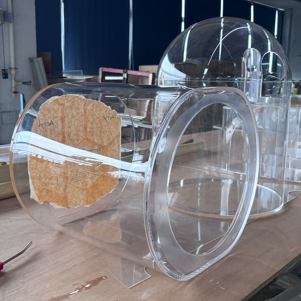 Large custom thermoformed acrylic hemisphere for high-end retail displays.