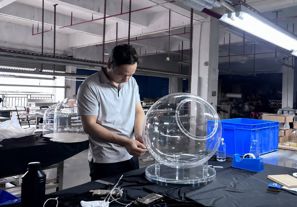 Precision-assembly-of-a-large-optical-grade-acrylic-pet-space-capsule,-bespoke-clear-lucite-dome-fabrication-for-high-end-furniture-OEMODM