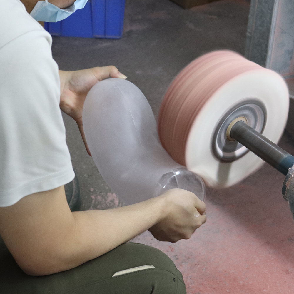 Skilled worker performing manual acrylic edge polishing