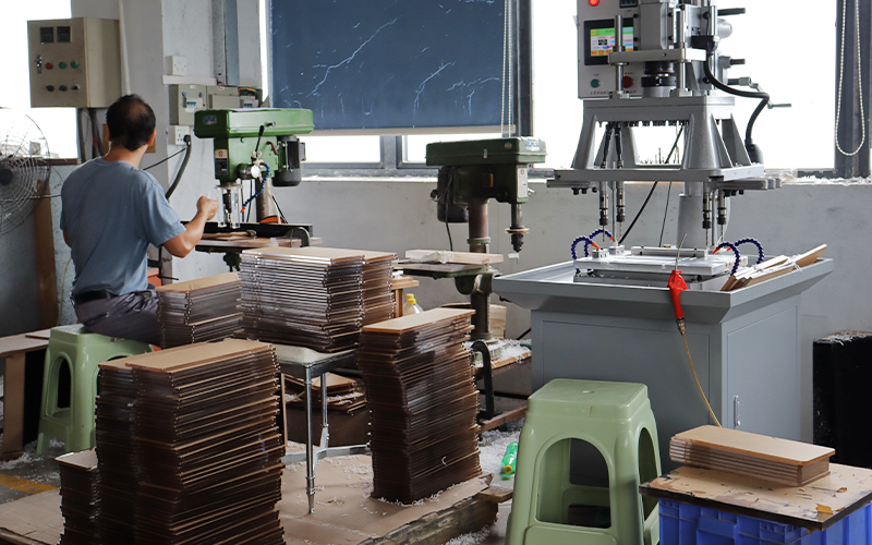 Specialized vertical drill press station for high-accuracy hole positioning.