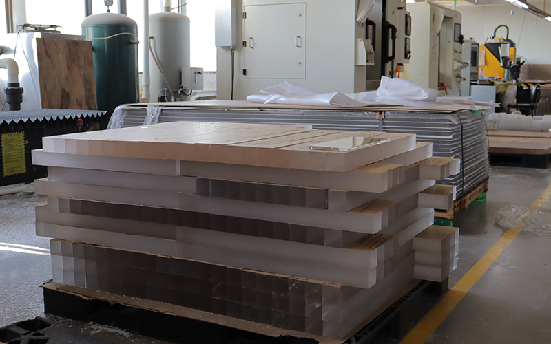 Stacks-of-high-purity-virgin-PMMA-thick-acrylic-slabs-ready-for-CNC-machining.