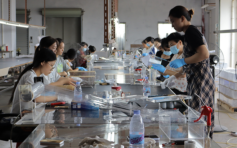 Synchronized assembly line for high-efficiency OEMODM acrylic fabrication projects.