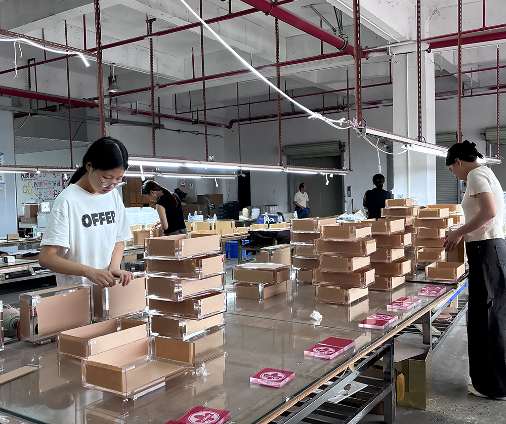Acrylic Display Box Assembly Line with Workers in a Manufacturing Workshop