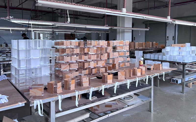 Batch Production of Clear Acrylic Display Boxes Staged on Factory Worktables