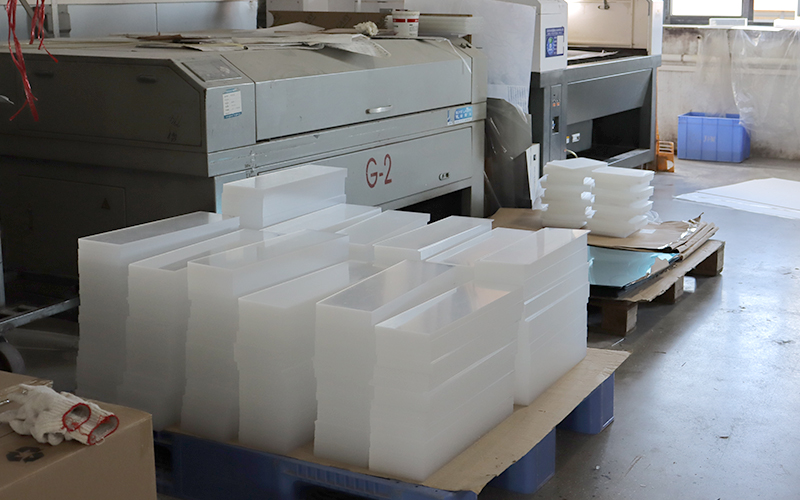Batch Production of Frosted White Acrylic Boxes and Components in a Manufacturing Workshop