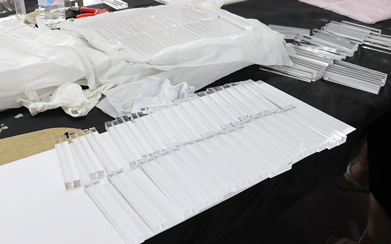 Batch of White Acrylic Panels and Custom-cut Components Ready for Processing