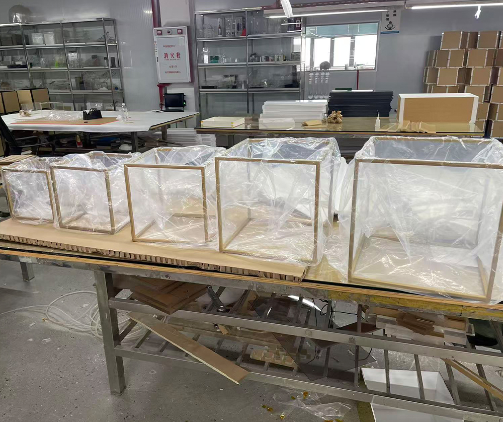 Clear Acrylic Display Boxes with Protective Film Staged for Quality Inspection
