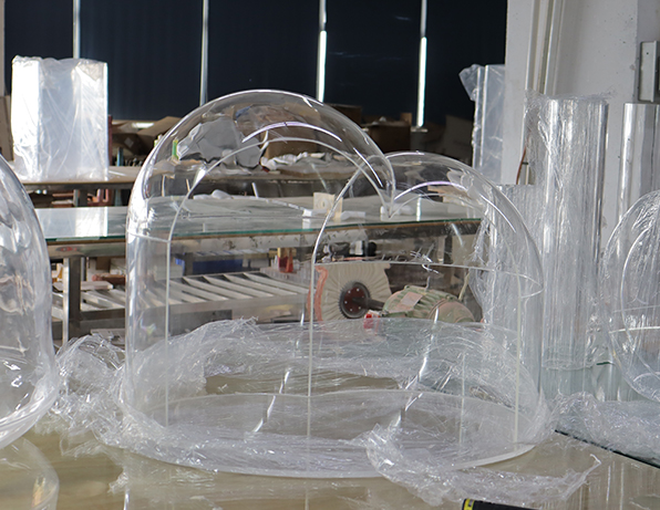 Clear Acrylic Dome Pet Enclosure in a Manufacturing Workshop