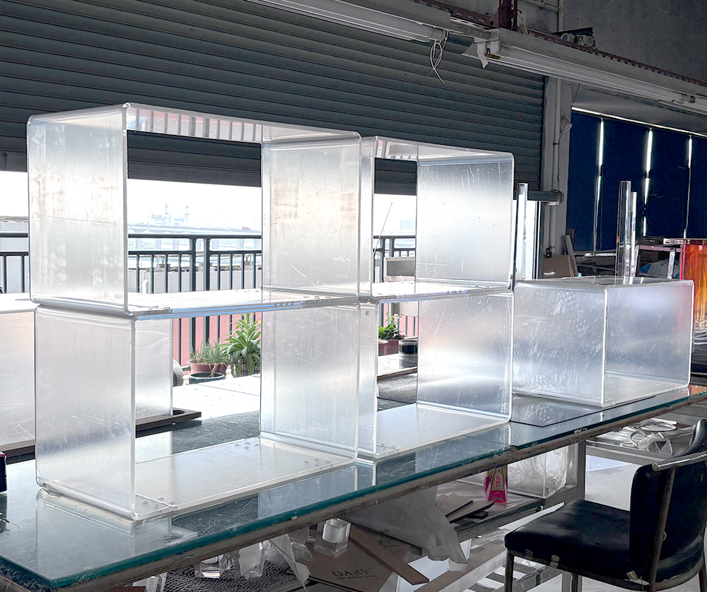 Clear and Frosted Acrylic Modular Display Cubes on a Factory Workbench