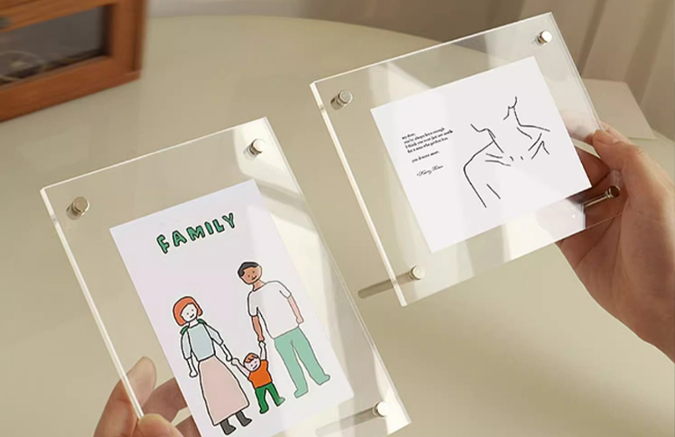 Custom clear acrylic picture frames with screw post mounting displaying artwork