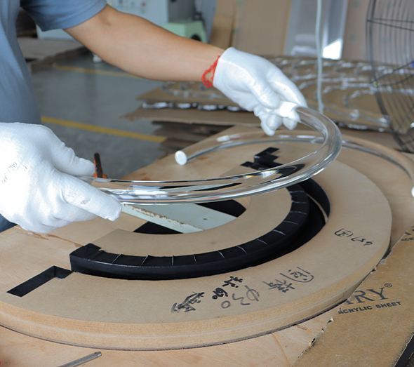 Custom curved acrylic tube forming and assembly for display and lighting applications