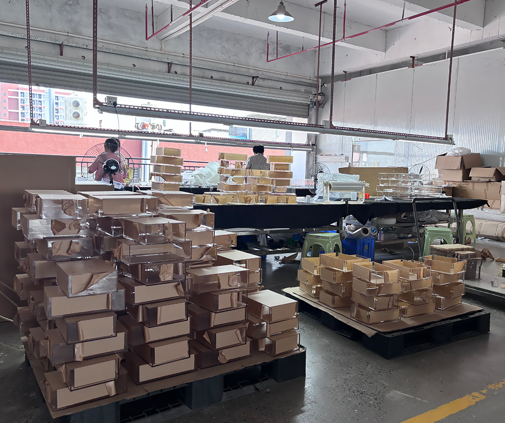 Finished Acrylic Display Boxes Staged for Inspection and Packaging in a Workshop