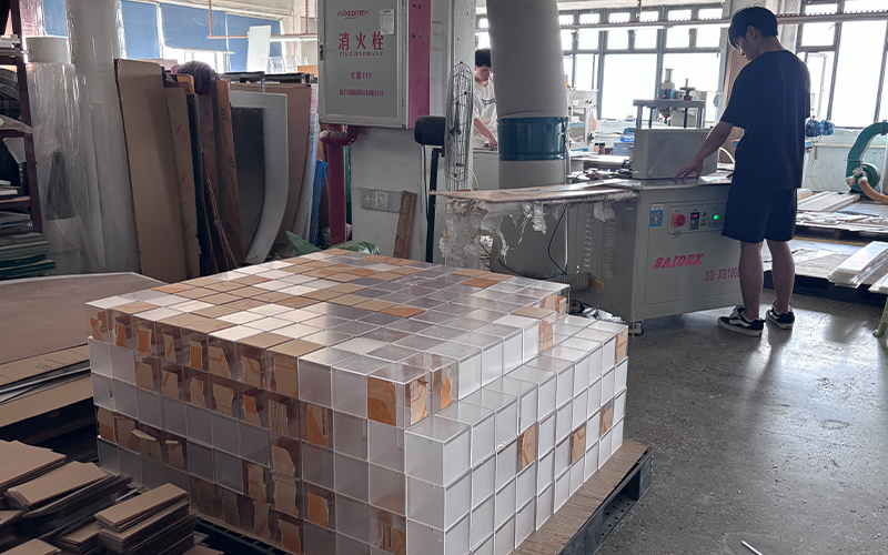 Industrial Acrylic Processing Workshop with Stacked Modular Acrylic Components