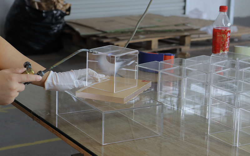 Manual Finishing of Clear Acrylic Display Boxes with a Pneumatic Hand Tool