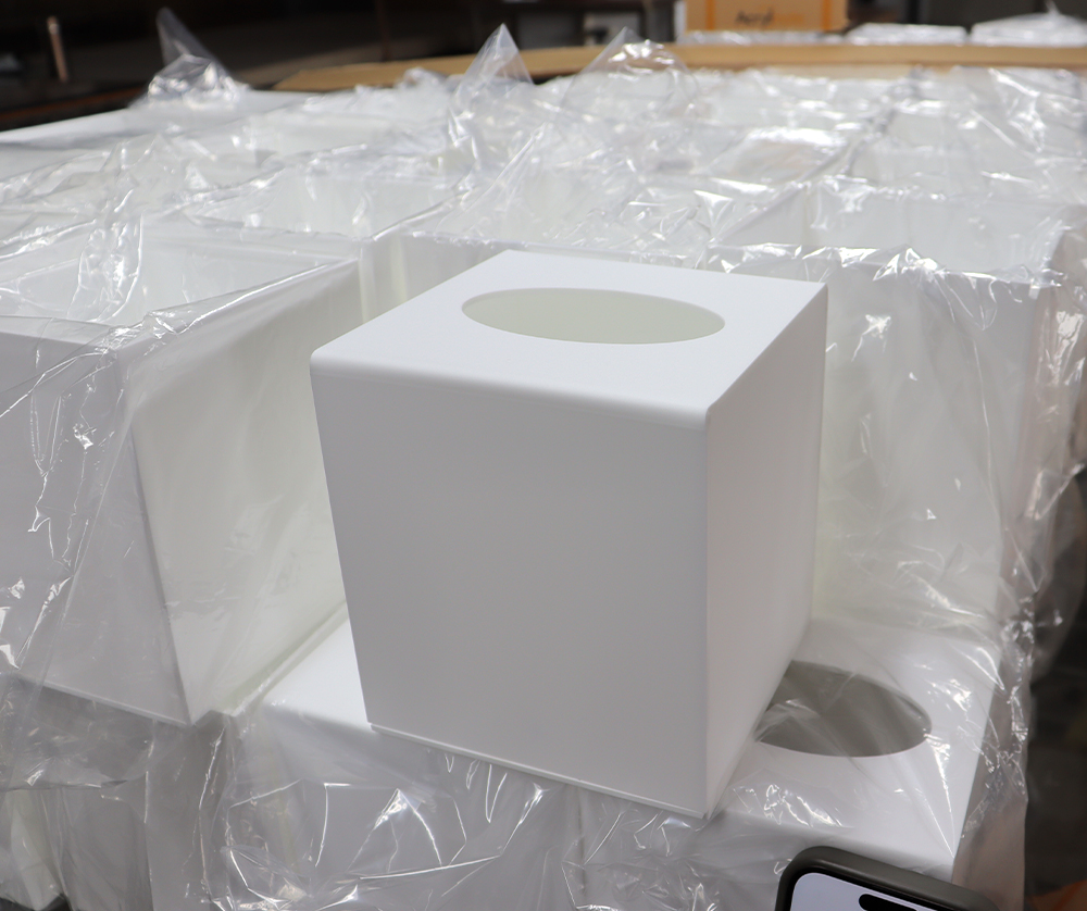 White Acrylic Cube Box with Circular Opening and Protective Packaging Film