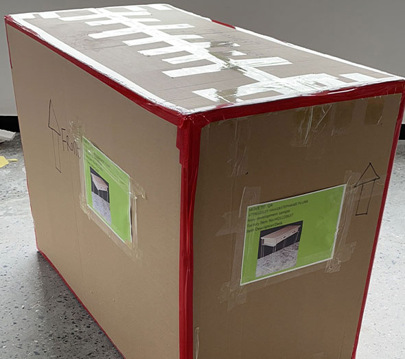 Acrylic desk packed in protective shipping box