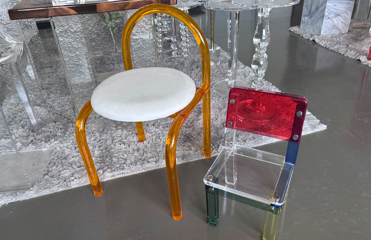 Amber acrylic chair with white cushion