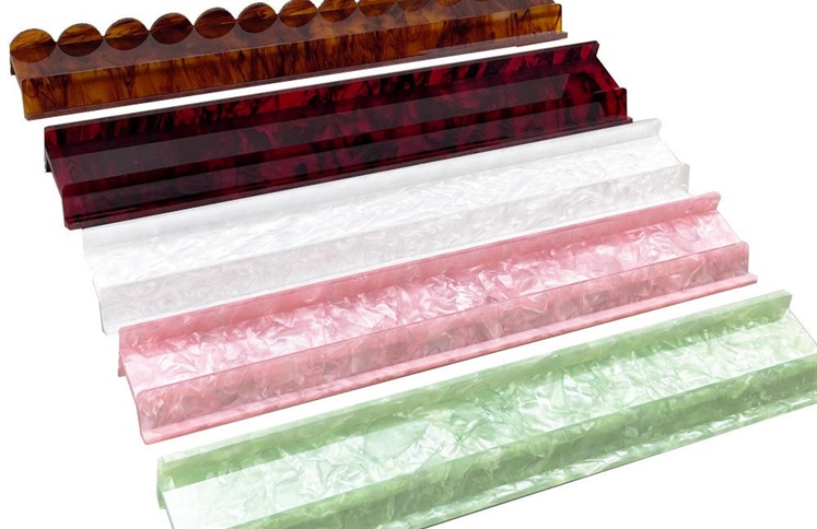 Assorted marble color acrylic mahjong tile racks in display