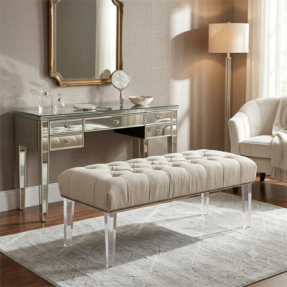 Beige tufted upholstered bench with clear acrylic tapered legs