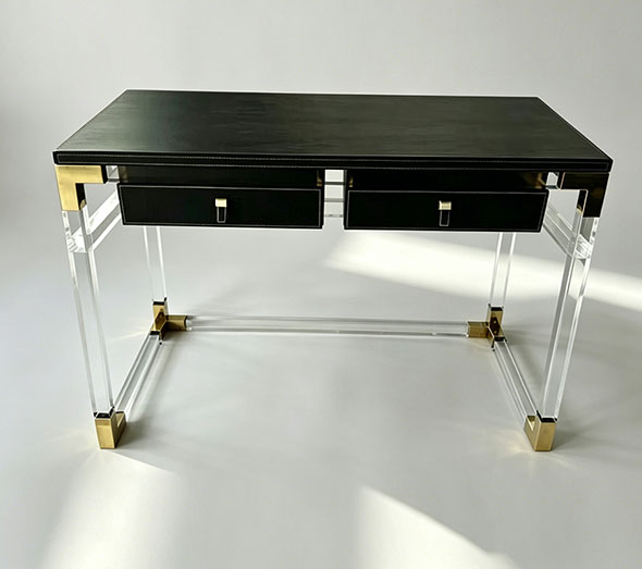 Black acrylic writing desk with gold accents