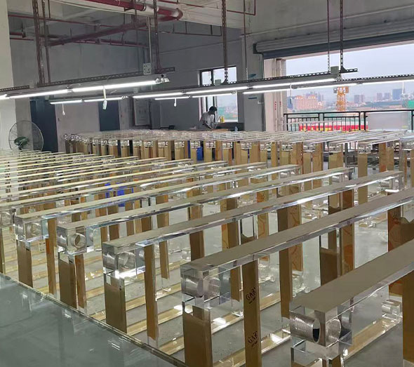 Bulk acrylic table frames in furniture factory