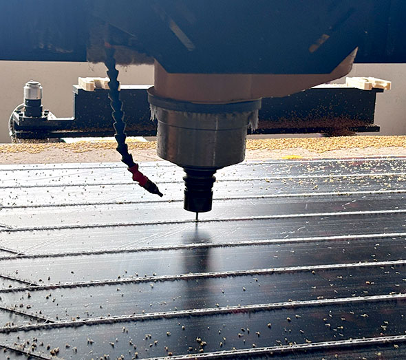 CNC machine cutting acrylic sheet for furniture production