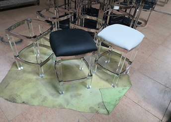 Chrome bar stools with black and white upholstered seats