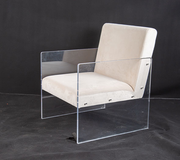 Clear acrylic armchair with white upholstered cushions