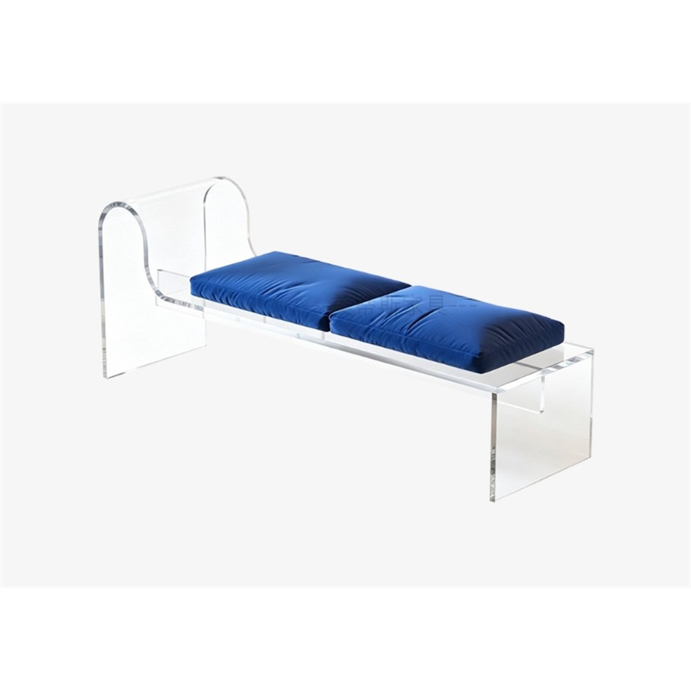 Clear acrylic bench with curved backrest and blue cushions