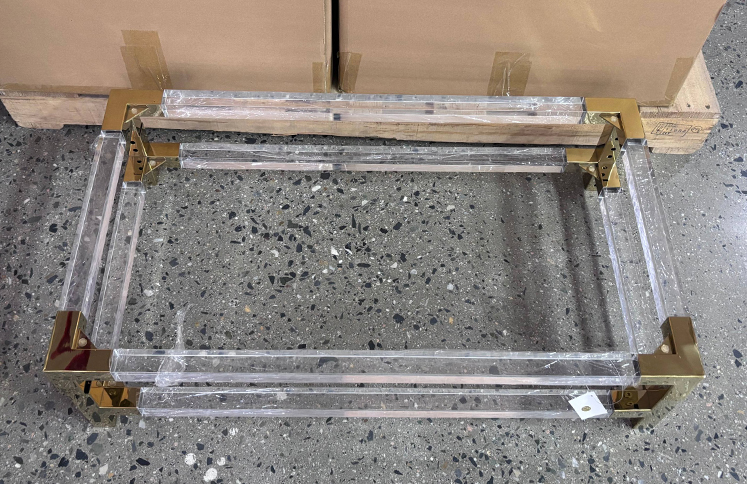Clear-acrylic-table-base-frame-with-polished-gold-corner-brackets