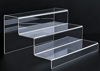 Clear acrylic tiered display riser for wholesale retail merchandising