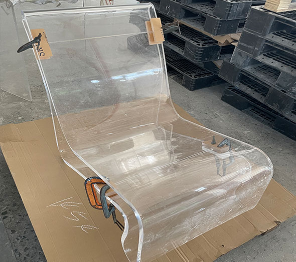 Custom molded clear acrylic chair in production