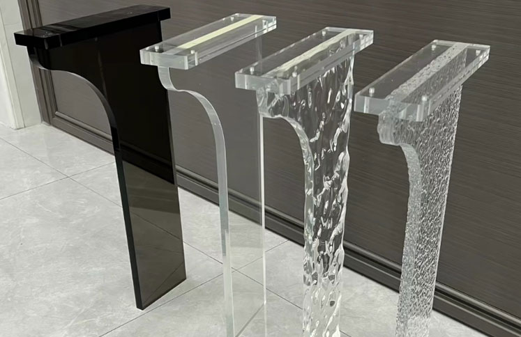 Custom textured acrylic table legs in clear and black