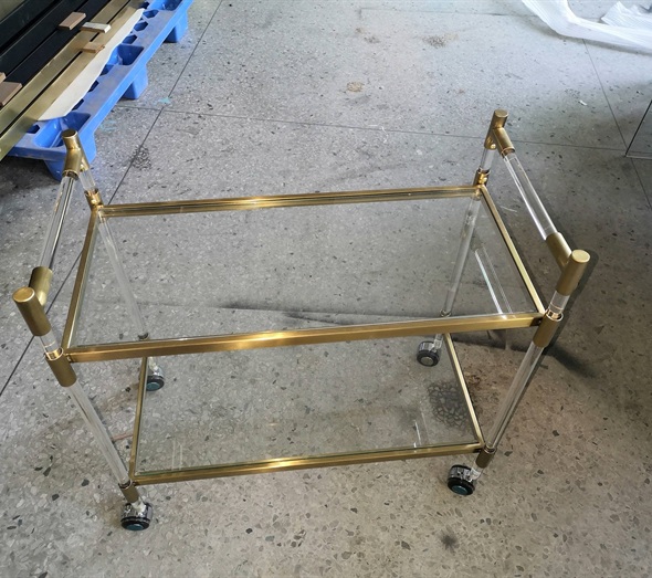 Gold metal and clear acrylic rolling service cart with wheels
