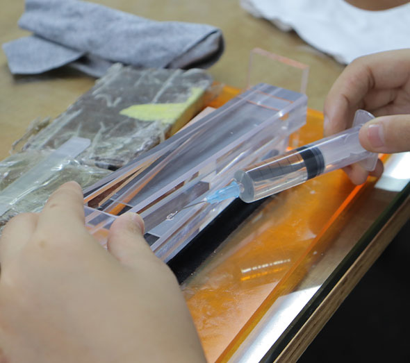 Hand bonding clear acrylic parts with adhesive