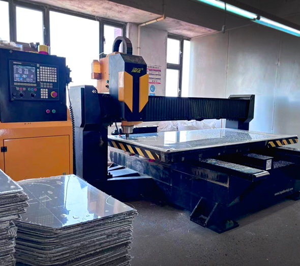 Industrial CNC engraving machine routing acrylic sheet in factory