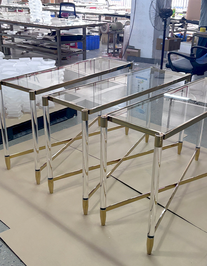 Modern rectangular glass console table with gold frame and acrylic legs