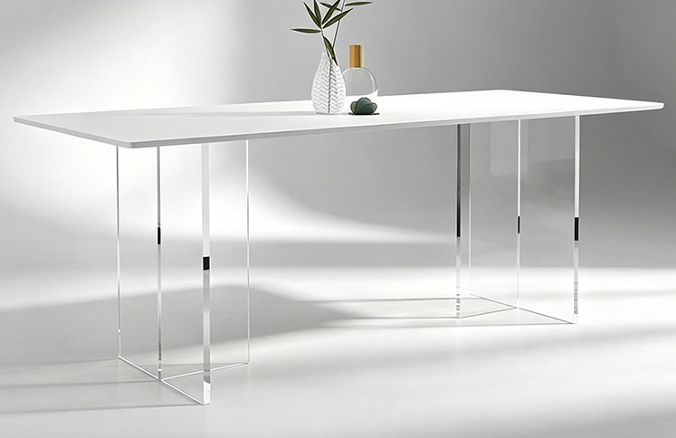 Modern white dining table with clear acrylic legs