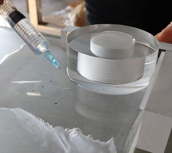 Precision bonding of clear acrylic furniture components