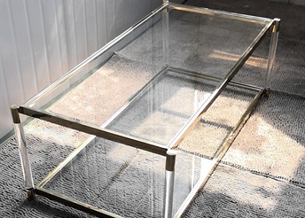 Rectangular glass coffee table with acrylic legs and gold frame