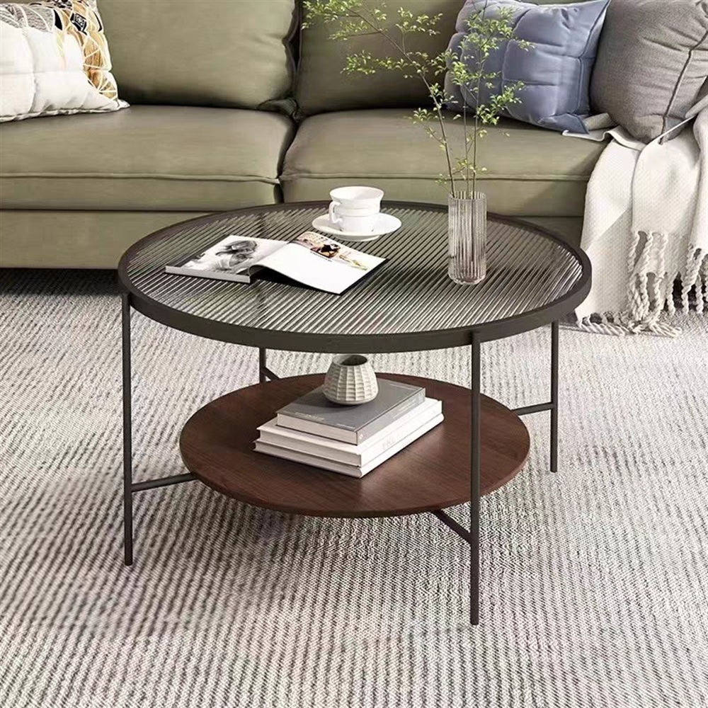Round fluted glass coffee table with black metal frame and wood shelf