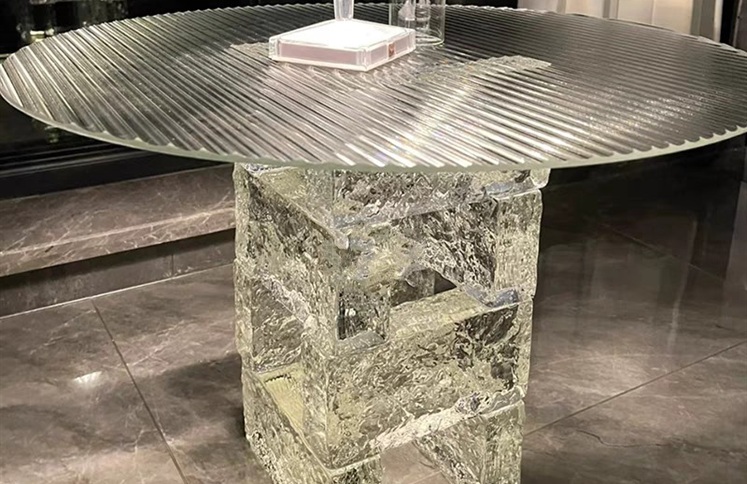 Round fluted glass table with textured acrylic block pedestal