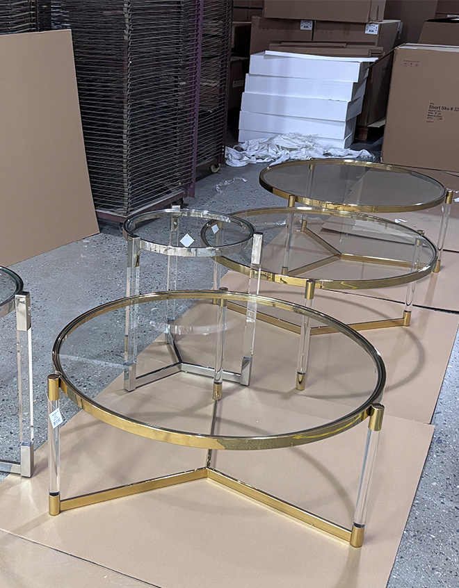 Round-glass-coffee-table-and-side-table-set-with-acrylic-legs-and-metal-trim