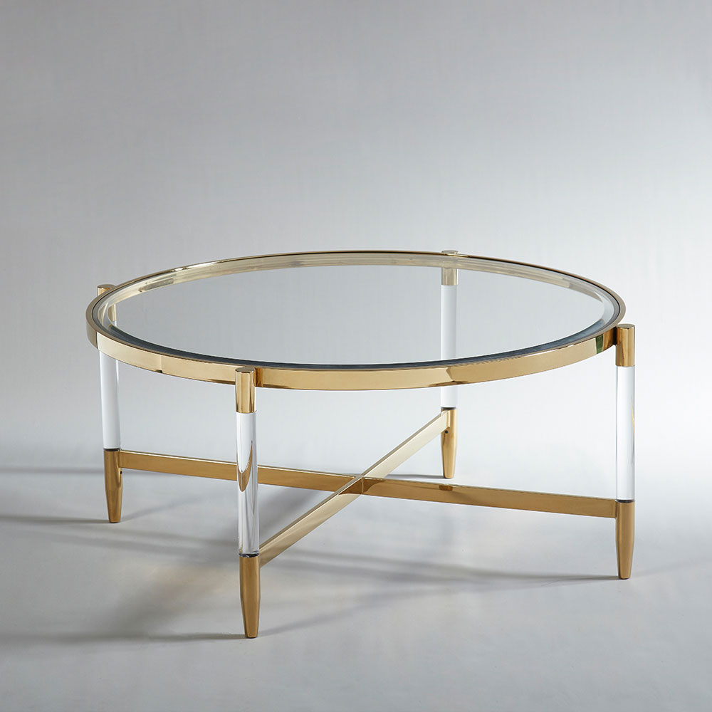 Round glass coffee table with gold and acrylic frame